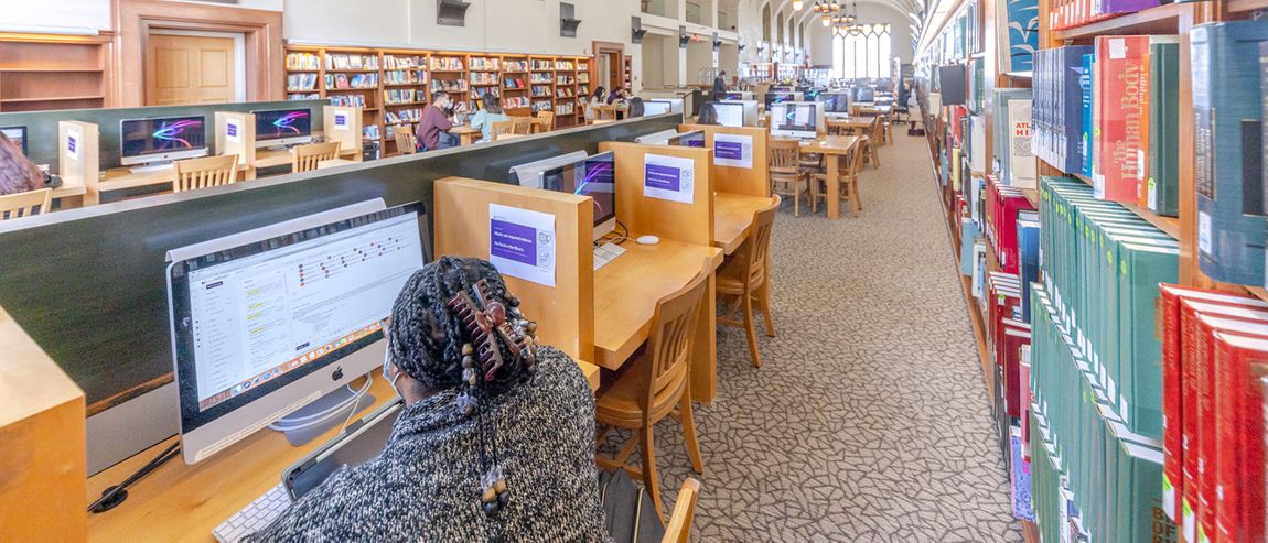 Student working on a computer at the Chalon Library.