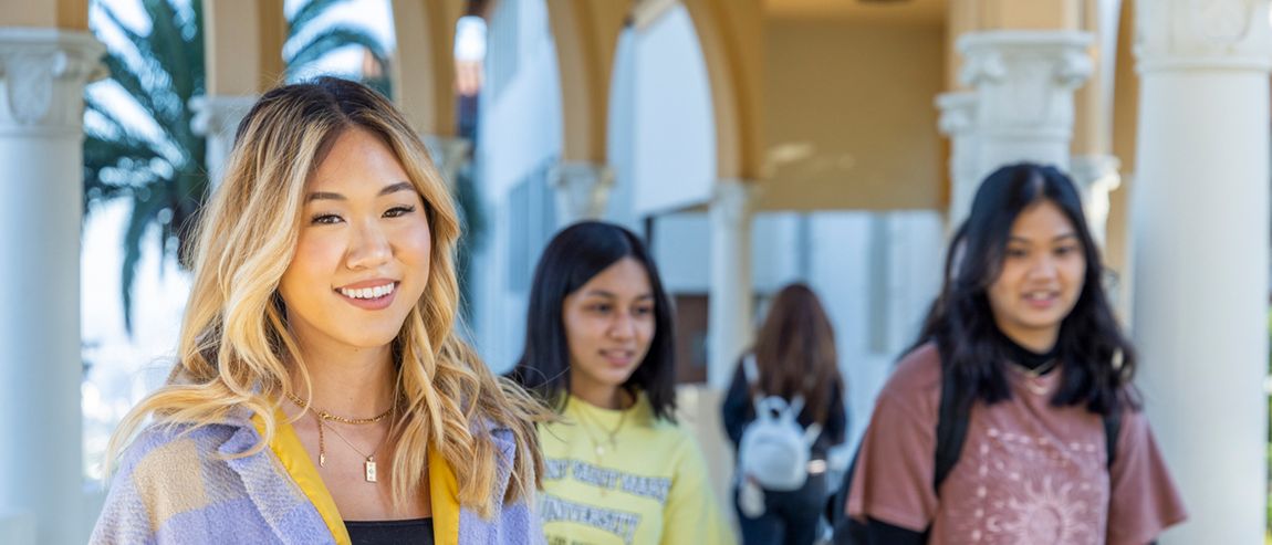 A student smiling at the Chalon Campus.