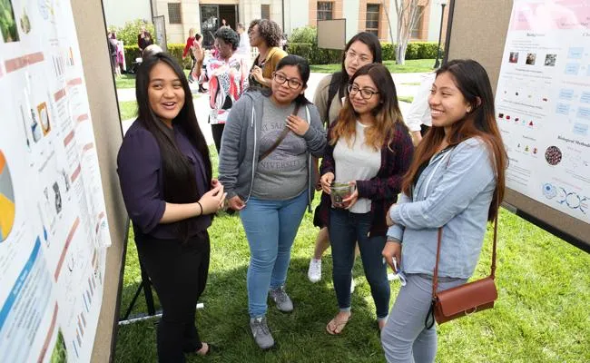 A student delivers a poster presentation during the University's 2018 Academic Symposium at the Mount's Chalon Campus.