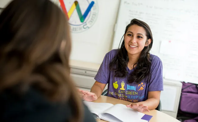 Peer wellness advocate Isabella Solano ’20 talks to her client, Martha Gonzalez ’21