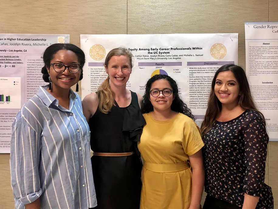 Psychology Assistant Professor Michelle Samuel (second, left) joins three of the student authors – (from left) Caitlyn Keeve, Carmen Ramos and Carla Canas – at a student psychology conference where they shared their research work.
