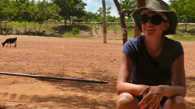 Global research and cultural understanding is an important part of women and gender studies as well as leadership. Here, Lia Roberts, PhD, chair of the history and political science department, enjoys a moment of rest during a trip to Ghana. Even the goat is ignoring her.