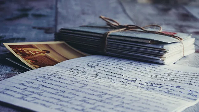 A collection of journal entries or letters, as depicted, could be the basis of a memoir.