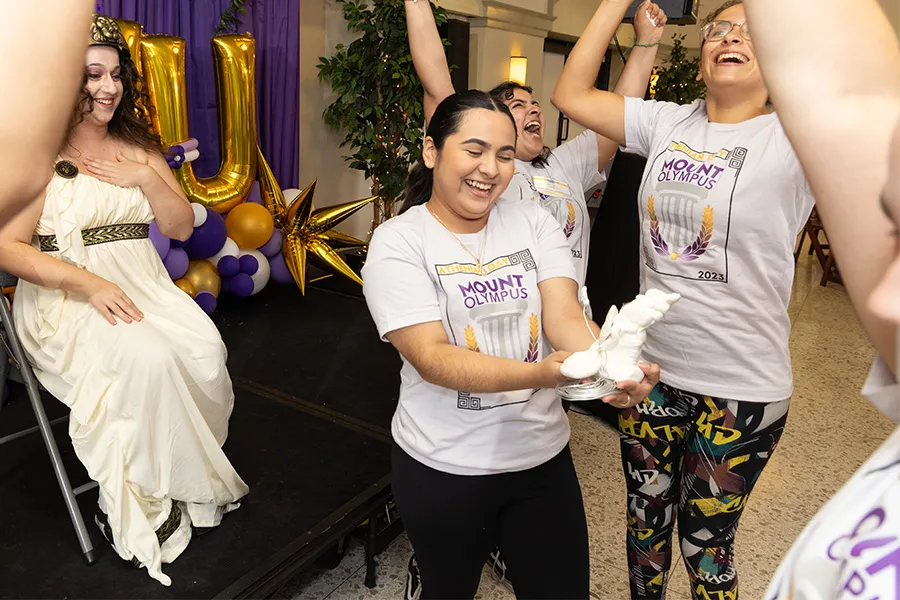 Students laughing and cheering during the competition