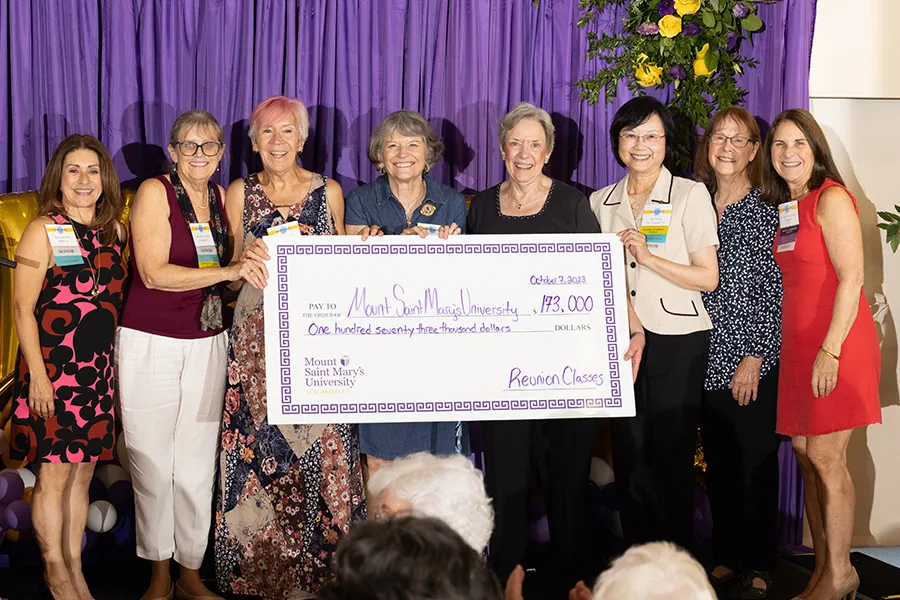 President Ann McElaney-Johnson (far right) received a check for $173,000 from approximately 220 donors to the reunion campaign. Presenting the check (left to right): Alumnae Association President Rosa White Year ‘81, ‘91 MBA, Mary Pat Gonzalez ‘73, Angie Samstag ‘73, Molly Mailloux ‘73, Mary Breden ‘73, Annie Yau Young ‘73, and Mary Strong ‘73.