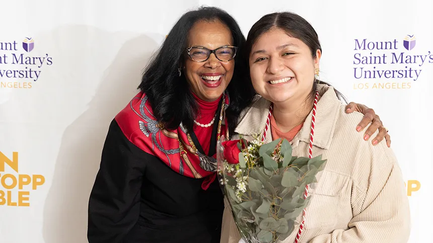 Linda McMurdock, vice president of Student Affairs, congratulates Mariana Sifuentes during ISAE's annual Bravo! dinner in the spring that celebrates graduating seniors and their families.