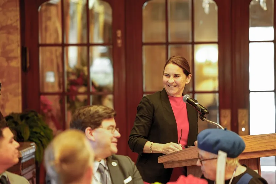 Ann McElaney-Johnson, PhD, president of Mount Saint Mary's University, shares updates from the University with attendees at the Heritage Society luncheon.