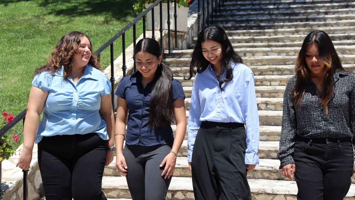 A student walking down stairs at Chalon Campus