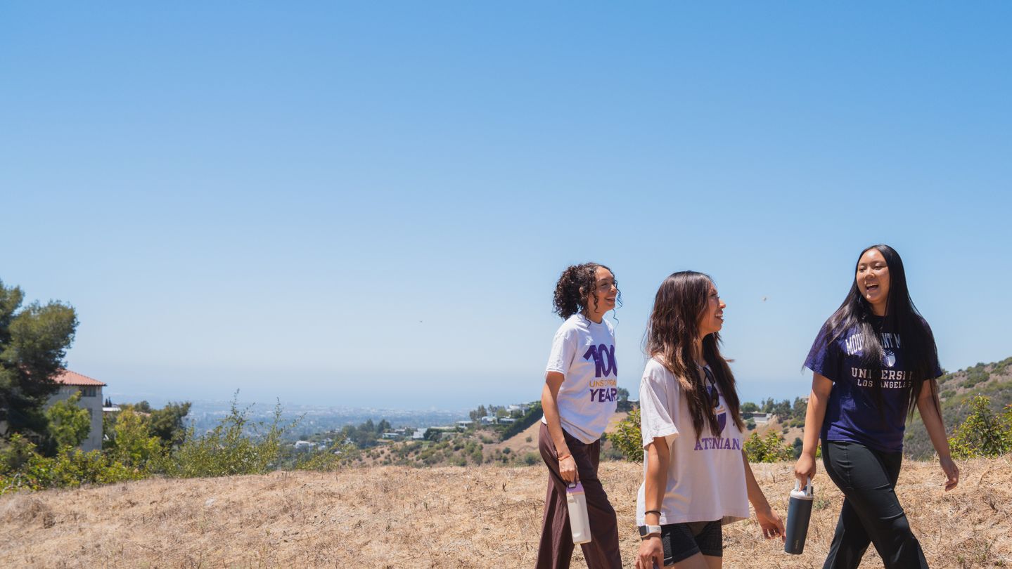 Three female students on a hike near Chalon Campus