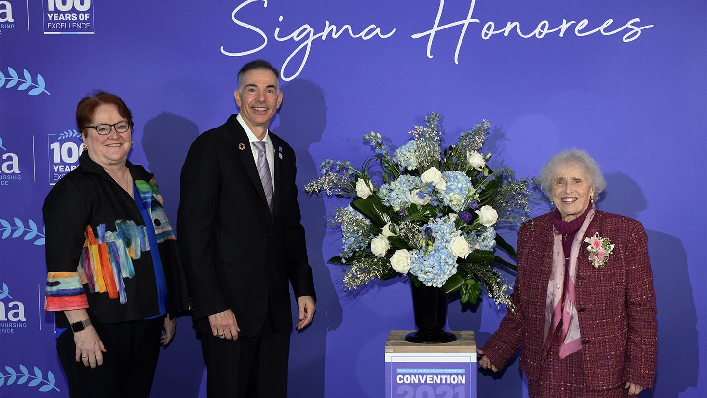Sister Callista Roy, CSJ, '63 received a lifetime achievement award from the Sigma Theta Tau International honor society of nursing at its biennial convention earlier this month. With her are Sigma Foundation's Elizabeth Madigan, PhD, Rn, FAAN, chief executive officer, and Richard Ricciardi, PhD, CRNP, FAANP, FAAN, president. Photo courtesy of King Shot Photography.