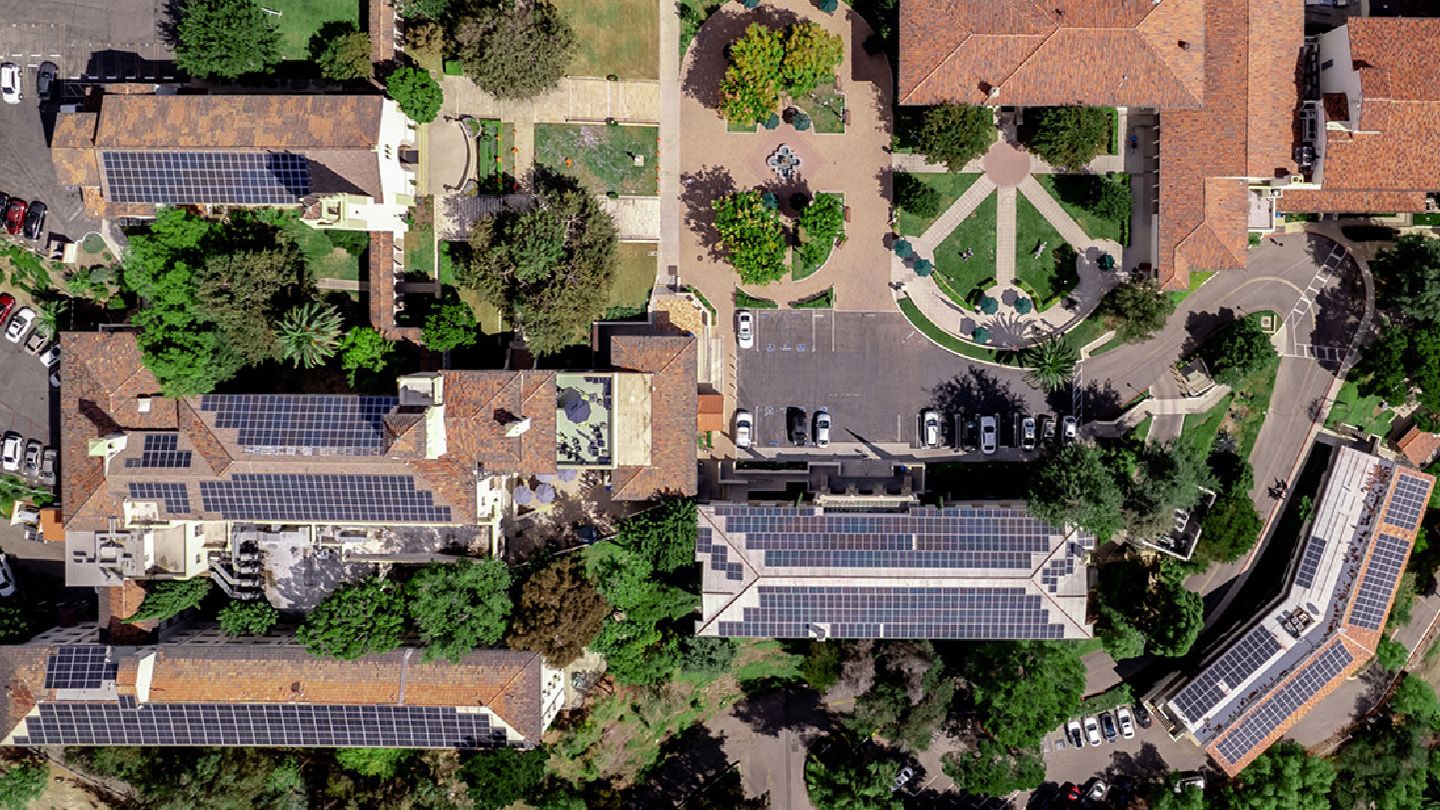 This drone shot above the Chalon Campus shows a number of its 1,084 solar panels. There are an additional 670 solar panels on Doheny Campus buildings.