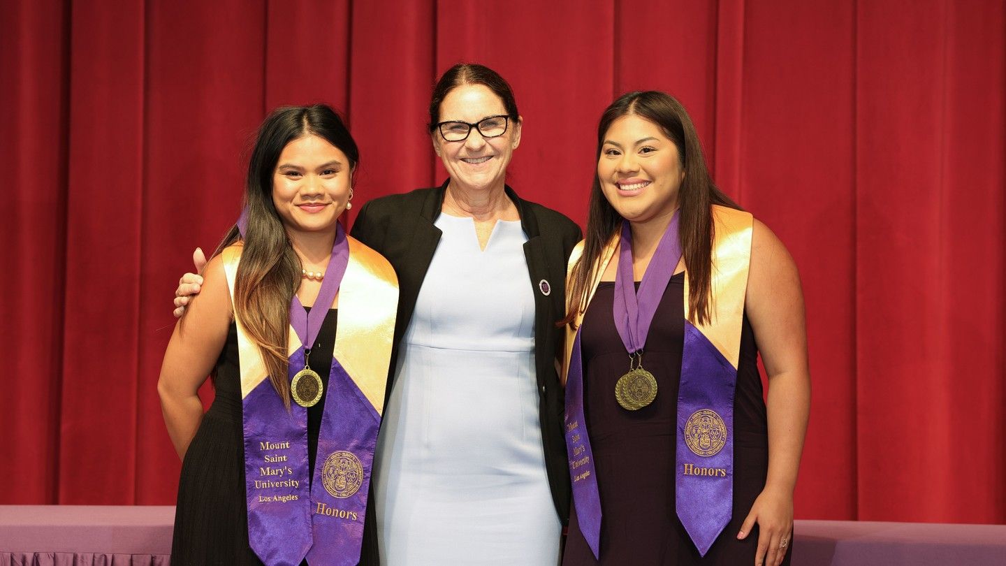 President Ann McElaney-Johnson with President's Award recipients Nichole Bondoco (left) and Karely Molina Martinez.