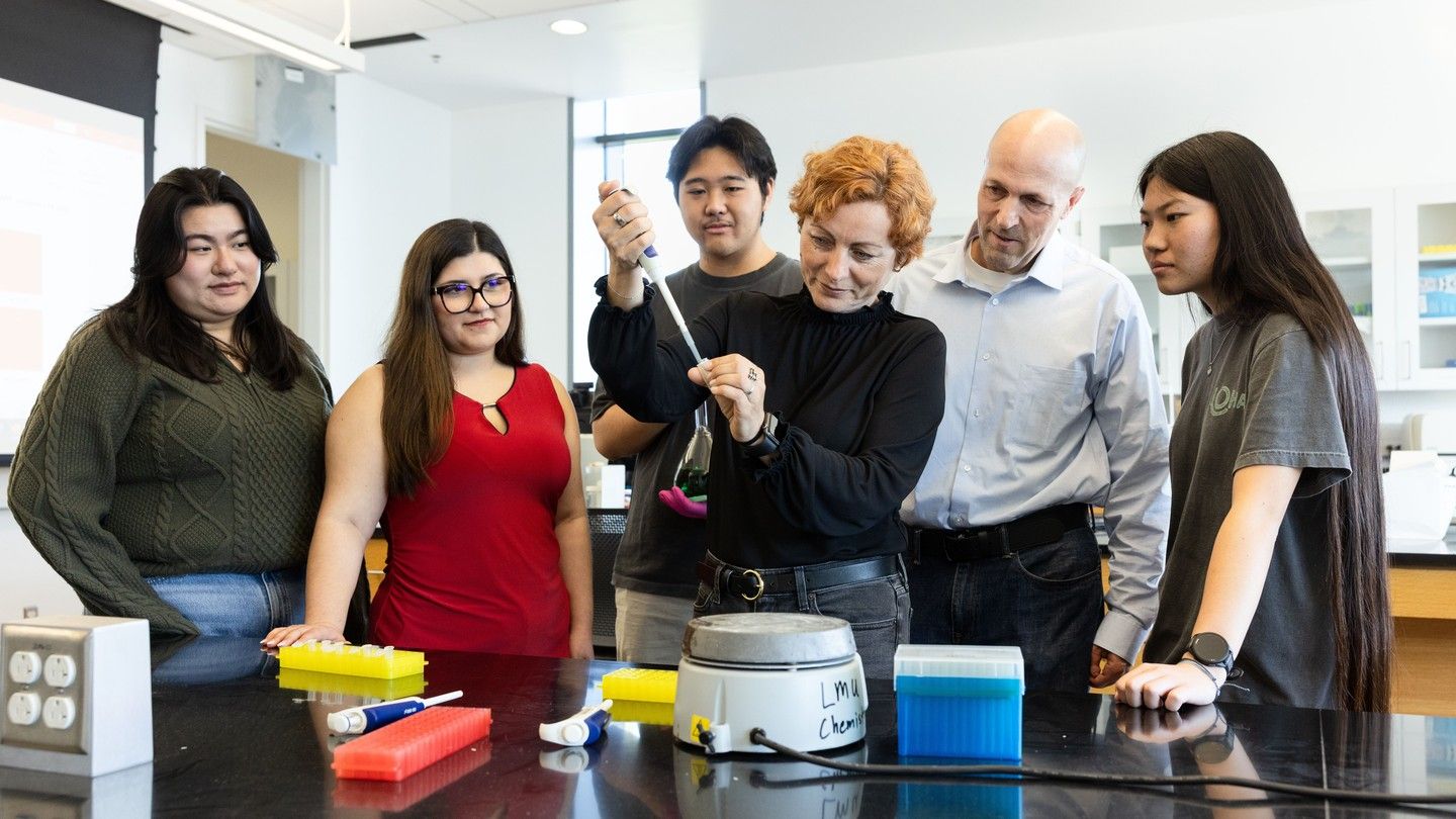 Luiza Nogaj, PhD (fourth from left), professor of biology at Mount Saint Mary’s University, and David Moffet, PhD (fifth from left), associate dean and professor of chemistry and biochemistry at LMU’s Frank R. Seaver College of Science and Engineering, work with Mount and LMU students in the lab as part of their ongoing research collaboration. Photo by Devin Feil, Loyola Marymount University
