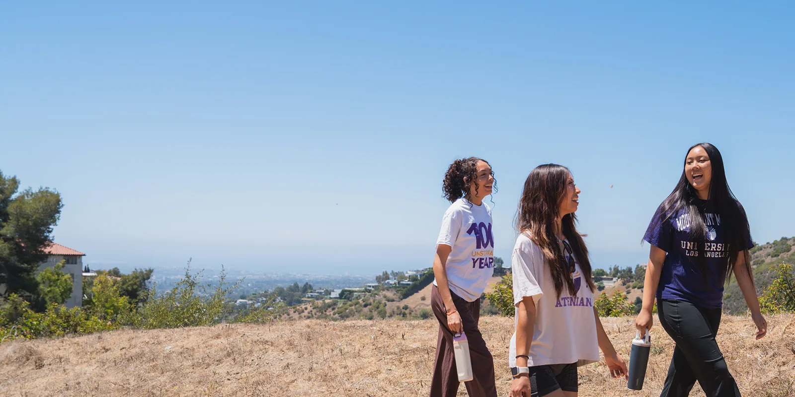Three female students on a hike near Chalon Campus