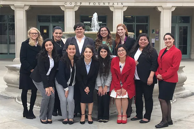 Professor Helen Boutrous with former Mount pre-law students competing at a moot court.