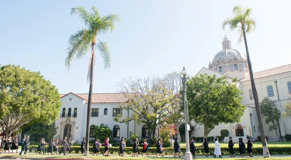 Class of 2018 graduates process from Doheny Campus to St. Vincent de Paul for Graduation Mass.