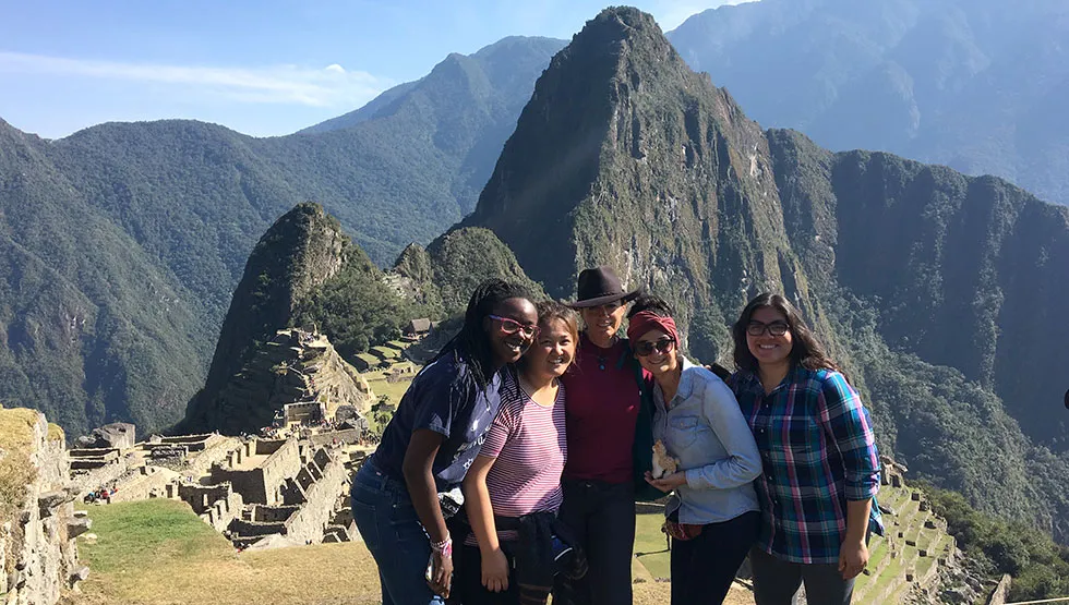 Professor Lia Roberts, PhD, center, with some of the students who traveled to Peru in August 2017 to study the country's healthcare system up close.