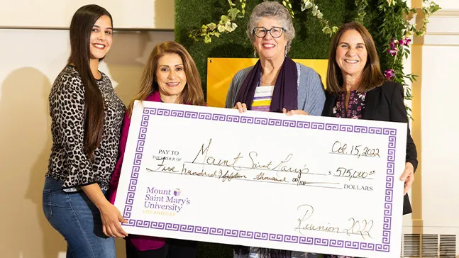 President Ann McElaney-Johnson (far right) received a check for $515,000 from approximately 200 donors to the reunion campaign. Presenting the check (left to right): Civil Hernandez ‘19, ’22 MBA, Alumnae Association President Rosa White Year ‘81, ‘91 MBA, and newly inducted Golden Graduate Society member Mary Durando ’72.