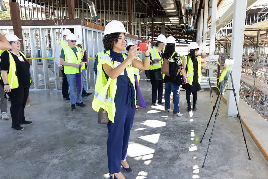 Alumnae visiting the construction site of the Wellness Pavilion.