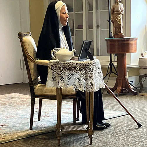 If it weren't for items like a modern-looking photo frame and electrical cords in the background, one could almost think this was Mother St. John Fontbonne sitting in the family home in Bas-en-Basset, France.