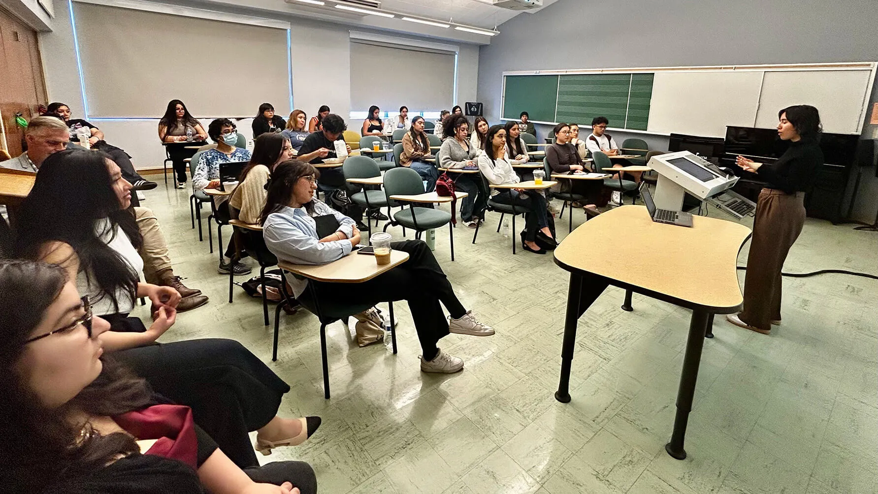 Graciela Escamilla ’25 sharing a presentation about research on 'Food, Women, and Work in the Borderlands.'