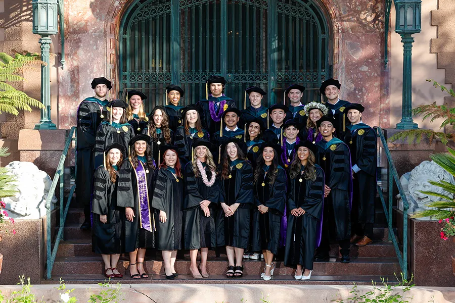 DPT Class of 2024 at the commencement ceremony in front of the Doheny Mansion.