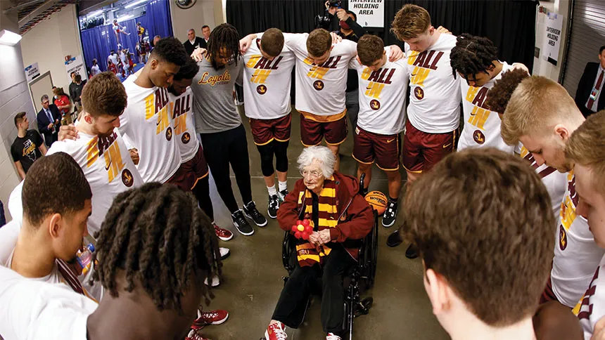 Sister Jean supporting the Loyola Ramblers’ players at one of their games.