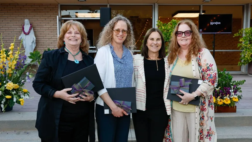 Professors Laurie Wright-Garry, Shelly Tochluk and Elizabeth Sturgeon celebrate 20 years of service at the Mount with President Ann McElaney-Johnson (third from left).
