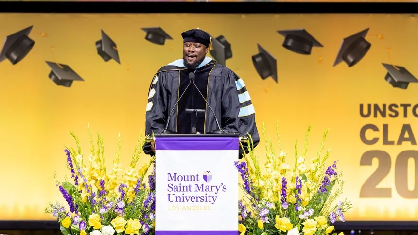 Ryan Smith, PhD, president and CEO of St. Joseph Center, delivers the keynote address at the graduate ceremony, inspiring graduates to lead with purpose and compassion.