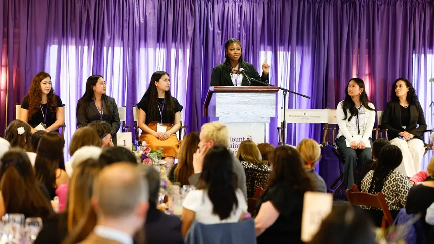 Left to right: Students from the Creative Collective — Julia Silveira ’28, Amy Elias ’28, Dulce Romero ’28, Jariah “Roxie” Bynum, Edidiong Akpakpen ’28 — and Campus Ministry and Spirituality Director Christie De La Gándara, PhD, during the student panel discussion.