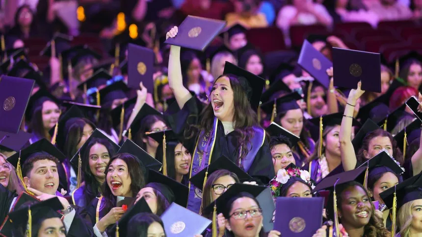 Graduates hold up their diplomas during Commencement 2026, marking the close of their academic journey at Mount Saint Mary's University.