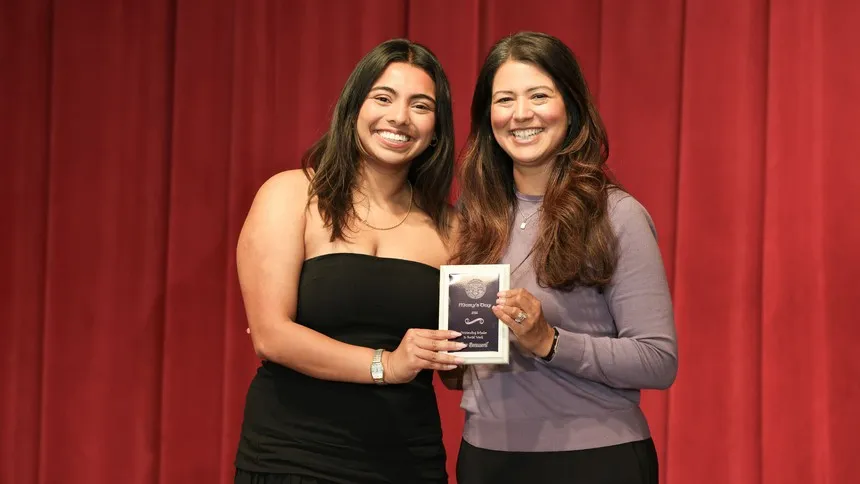 Amanda Romero, EdD (right), chair of the Department of Social Work, with one of the  Outstanding Scholar in Social Work honorees.