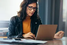 Woman using a laptop in an office