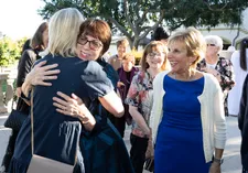 Alumnae embracing during Homecoming reunion