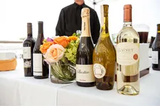 outdoor event with people mingling and ocean views