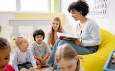 Teacher playing with children