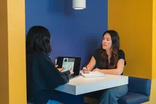 Students working together at a table.