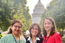 3 students standing in front of capitol building