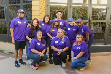 A group of alums in purple msmu polos