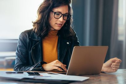 Woman using a laptop in an office