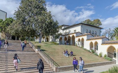 Students walking at the stairs of the Chalon Campus