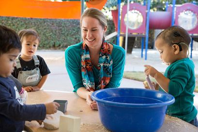 Teacher playing with students