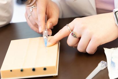 A student pipetting