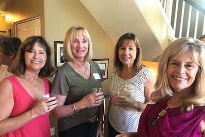 alumnae smiling at a party