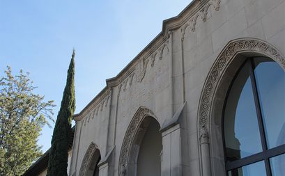The front of a large, stone library building.