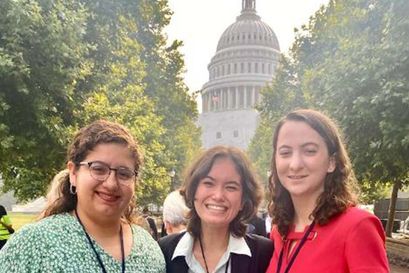 3 students standing in front of capitol building