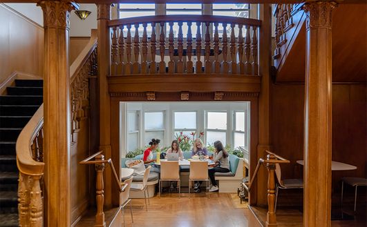Students Hanging Out Under Stairs