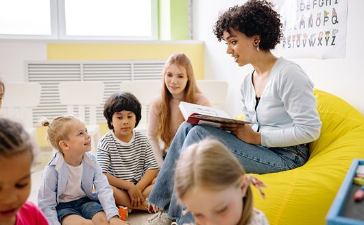 Teacher playing with children