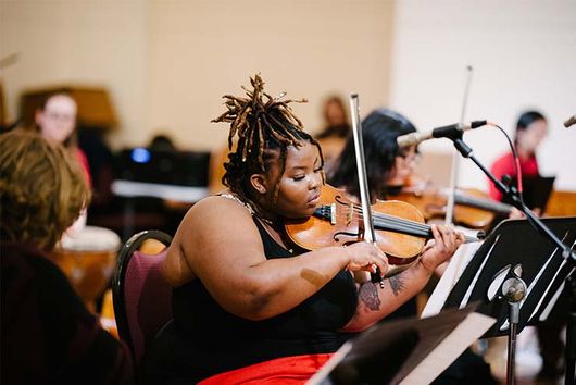 student playing the violin