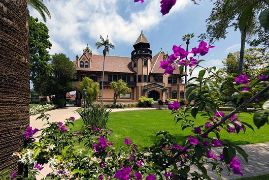 Doheny mansion with purple flowers
